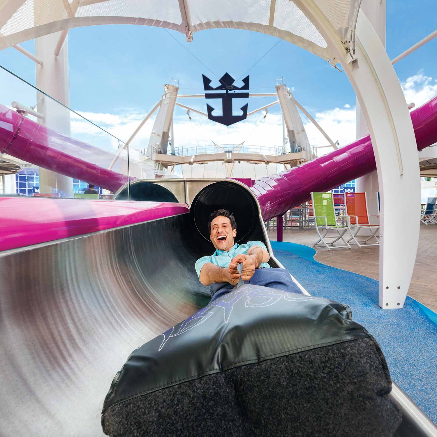 Royal Caribbean - man going down slide