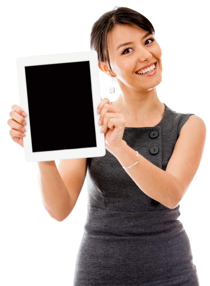 Business woman holding a tablet computer - isolated over a white background