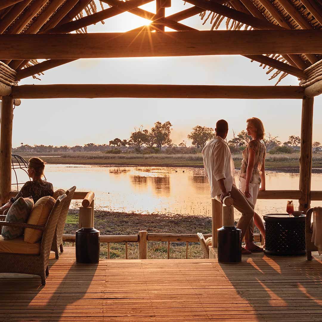 Travelers on a deck enjoying the view