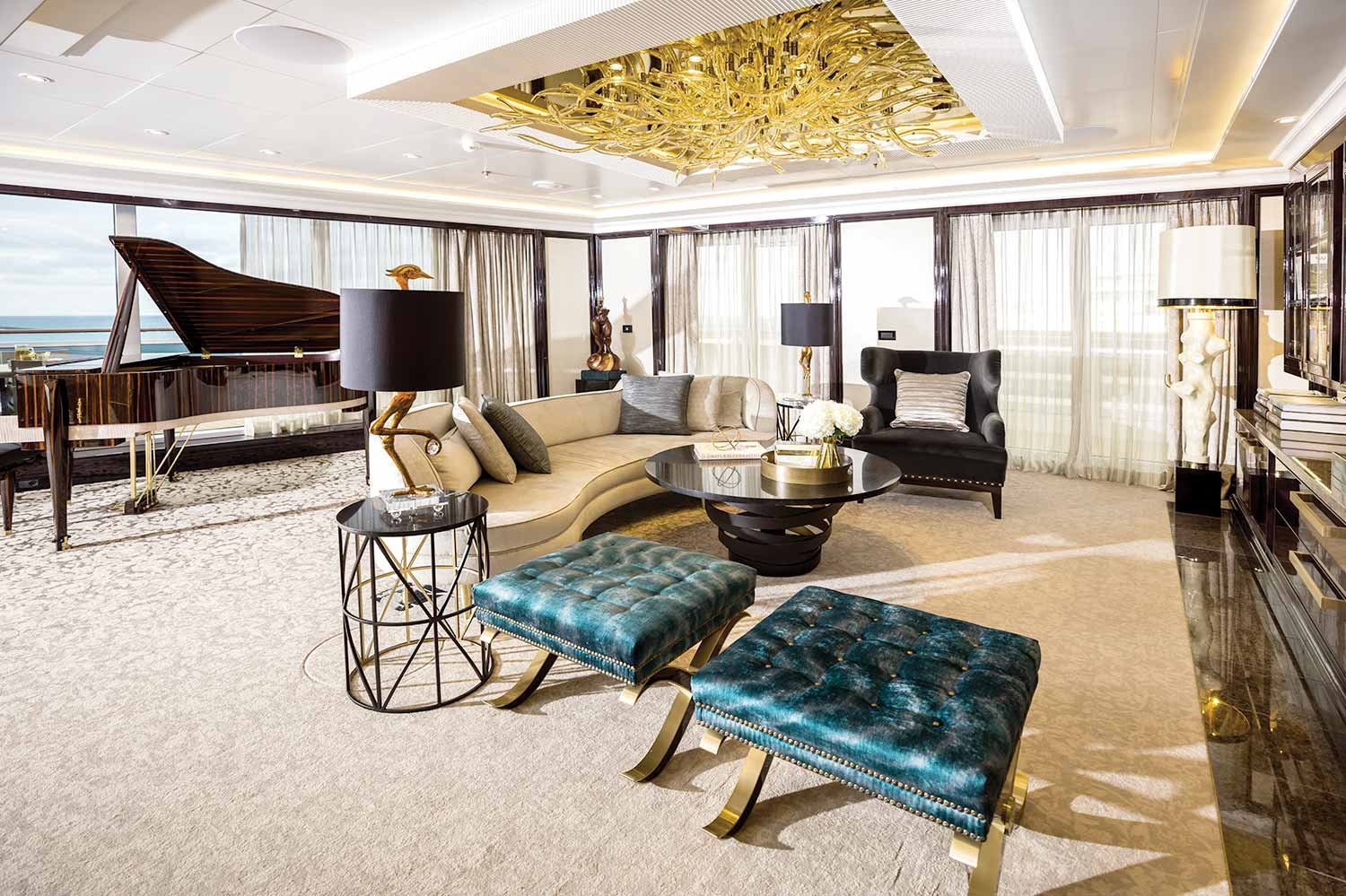 Large room with piano, couch and chairs